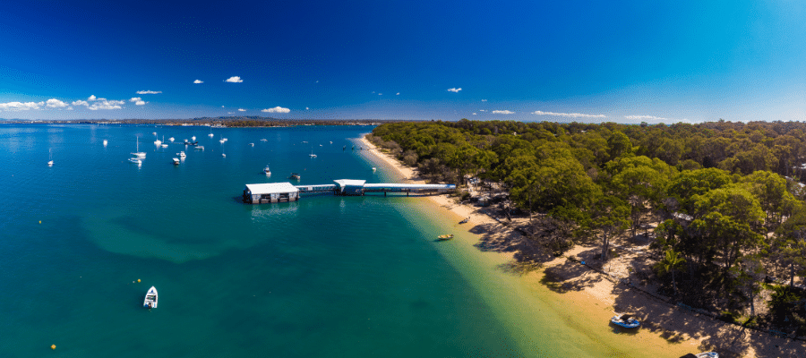 Sunny day at Coochiemudlo Island Brisbane Queensland Boats on blue water